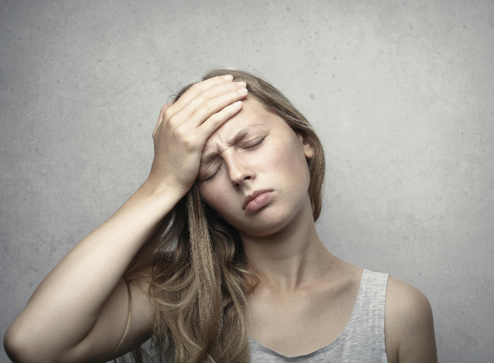 A woman experiencing travel fatigue